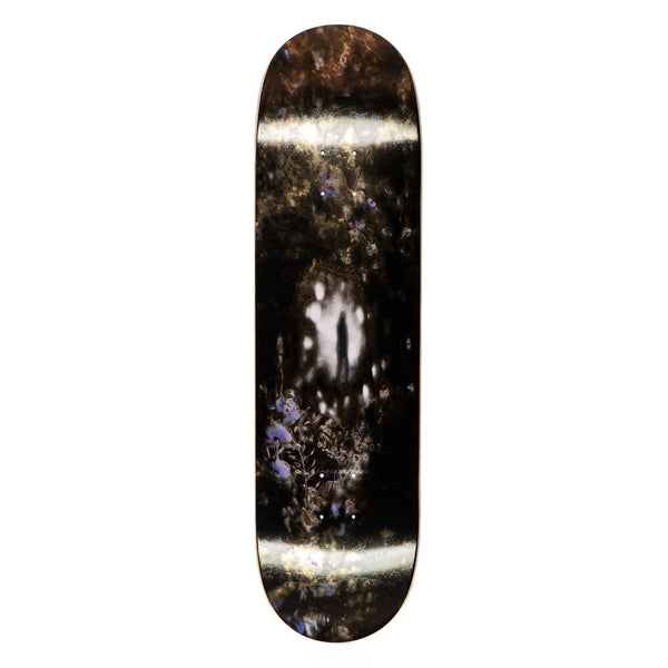 A LIMOSINE REPTILIAN skateboard with a black and white image on it.