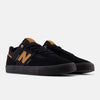 A pair of NB NUMERIC FOY 306 BLACK / BROWN sneakers by NB NUMERIC, featuring black uppers with brown details, displayed at an angle to show the side and front against a plain white background.