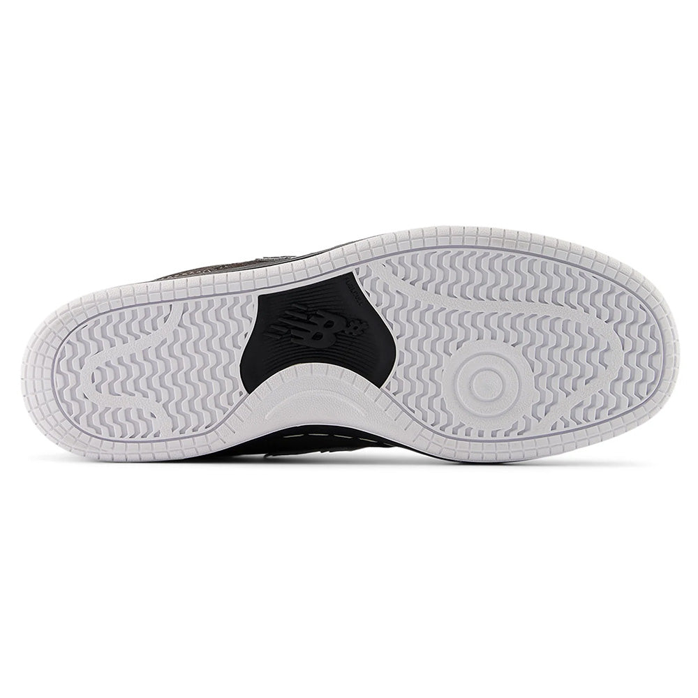 The NB NUMERIC 480 BLACK CEMENT / WHITE sneaker features a white rubber sole with patterned treads, ABZORB in-sole cushioning, and a black NB NUMERIC logo at the center.