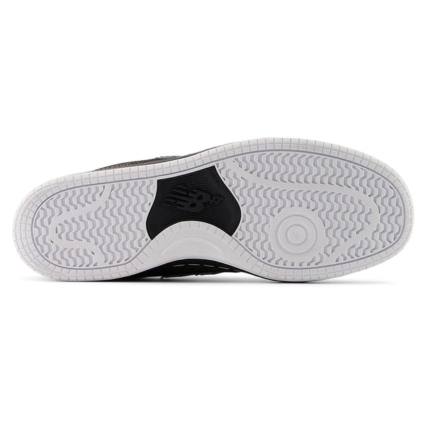 The NB NUMERIC 480 BLACK CEMENT / WHITE sneaker features a white rubber sole with patterned treads, ABZORB in-sole cushioning, and a black NB NUMERIC logo at the center.