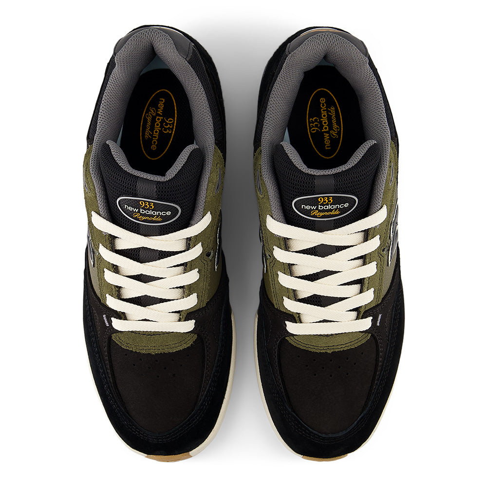 A pair of NB NUMERIC REYNOLDS 933 sneakers in black and dark olivine by NB NUMERIC, shown from above with white laces, a gray inner lining, and a comfortable ABZORB in-sole.