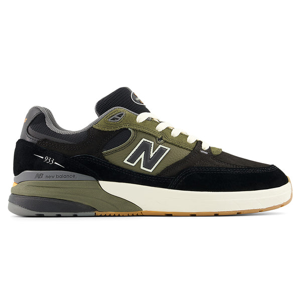 The NB NUMERIC REYNOLDS 933 BLACK / DARK OLIVINE sneaker by NB NUMERIC features a black, dark olivine, and white colorway with ABZORB cushioning, shown from the side on a plain white background.