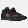 Introducing the NB NUMERIC X CHOCOLATE 480 HIGH BLACK / RED sneakers, featuring a striking red "N" logo on the sides, black laces, and a textured sole. With NB NUMERIC's advanced design, these black high-top skate shoes guarantee comfort and style for every kickflip.