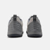 Rear view of a pair of NB NUMERIC NB NUMERIC X AUDAZO "GREY DAYS" with a textured pattern on the heels, black pull tabs, and Fresh Foam cushioning for enhanced comfort.