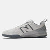 Gray athletic shoe featuring a large dark gray "N" on the side, lace-up design, and a textured sole. The NB NUMERIC NB NUMERIC X AUDAZO "GREY DAYS" hybrid futsal and skate shoe offers enhanced performance with Fresh Foam cushioning for superior comfort.