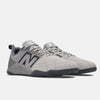 A pair of grey NB NUMERIC sneakers with black detailing and laces, featuring the brand's logo on the side and Fresh Foam cushioning for ultimate comfort, displayed on a white background.