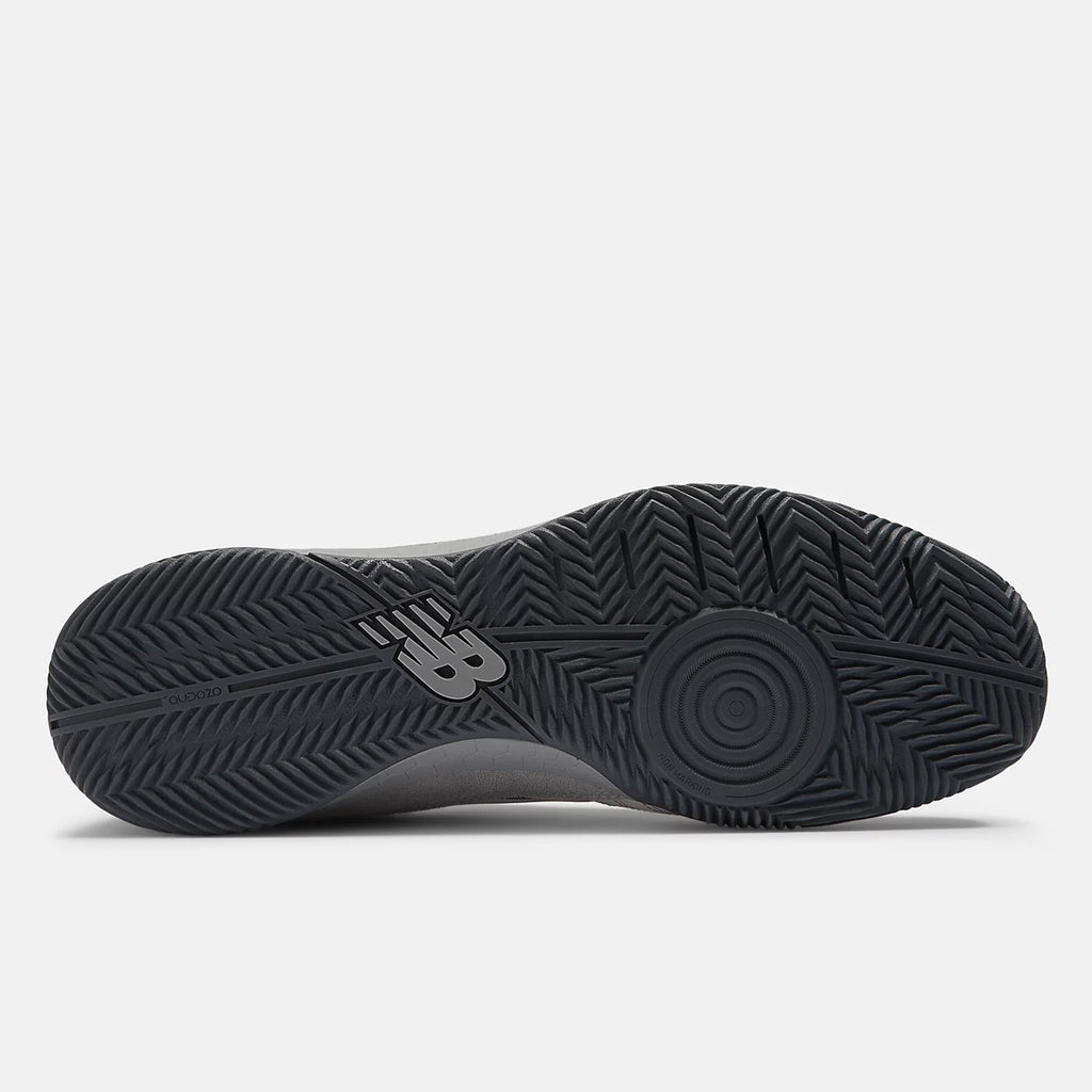 Bottom view of a NB NUMERIC shoe showcasing a black rubber sole with a herringbone tread pattern and Fresh Foam cushioning near the midfoot. The NB NUMERIC logo is visible on the arch area, enhancing this hybrid futsal and skate shoe with both style and performance.