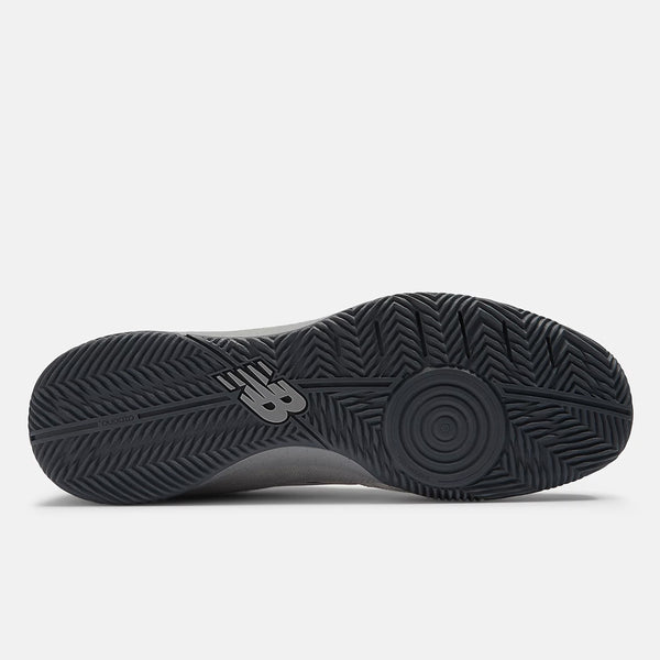 Bottom view of a NB NUMERIC shoe showcasing a black rubber sole with a herringbone tread pattern and Fresh Foam cushioning near the midfoot. The NB NUMERIC logo is visible on the arch area, enhancing this hybrid futsal and skate shoe with both style and performance.