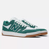 NB NUMERIC's 480 VINTAGE TEAL/WHITE sneakers blend green and white hues with a gum sole and the iconic "N" on the sides, offering stylish appeal. Crafted with ABZORB in-sole technology, they ensure superior comfort at every step.