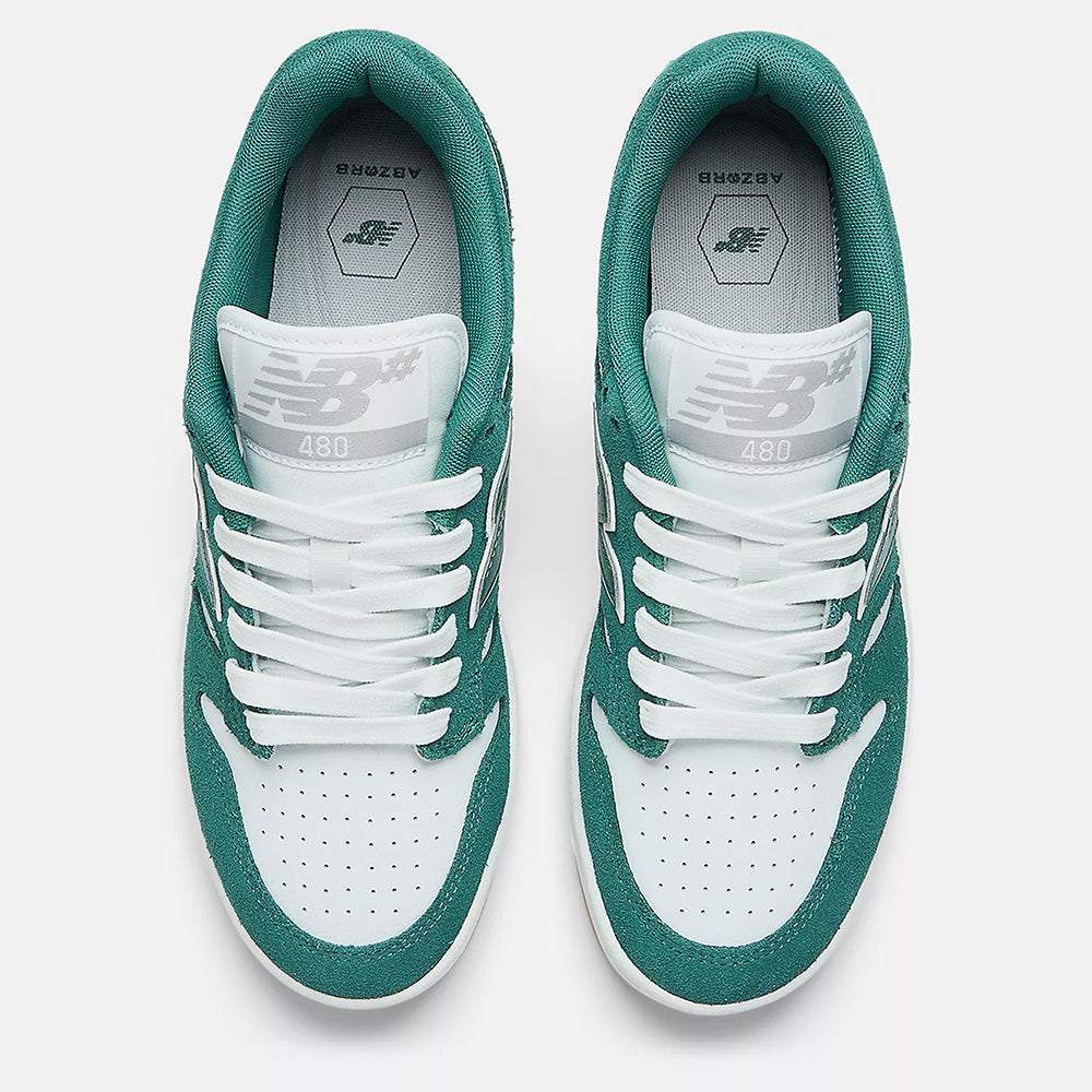 Top view of NB Numeric 480 sneakers in vintage teal and white, featuring perforated toes, a visible logo on the tongue, and ABZORB in-sole for enhanced comfort.