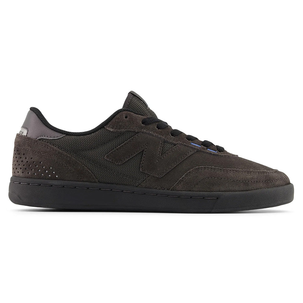 The NB NUMERIC 440 V2 BLACK CEMENT / BLACK sneaker, a black suede and mesh cupsole skate shoe by NB NUMERIC, is displayed in a side view on a white background.