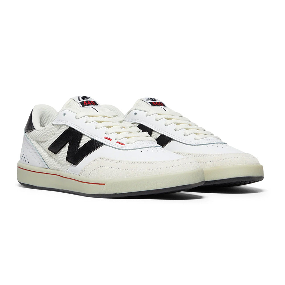 The NB NUMERIC 440 V2 in white and black features red details and cupsole construction—perfect for the everyday skater seeking style and performance.