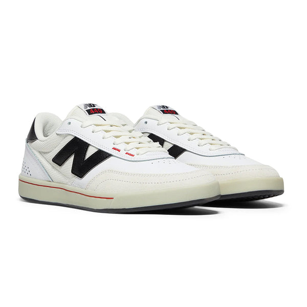 The NB NUMERIC 440 V2 in white and black features red details and cupsole construction—perfect for the everyday skater seeking style and performance.