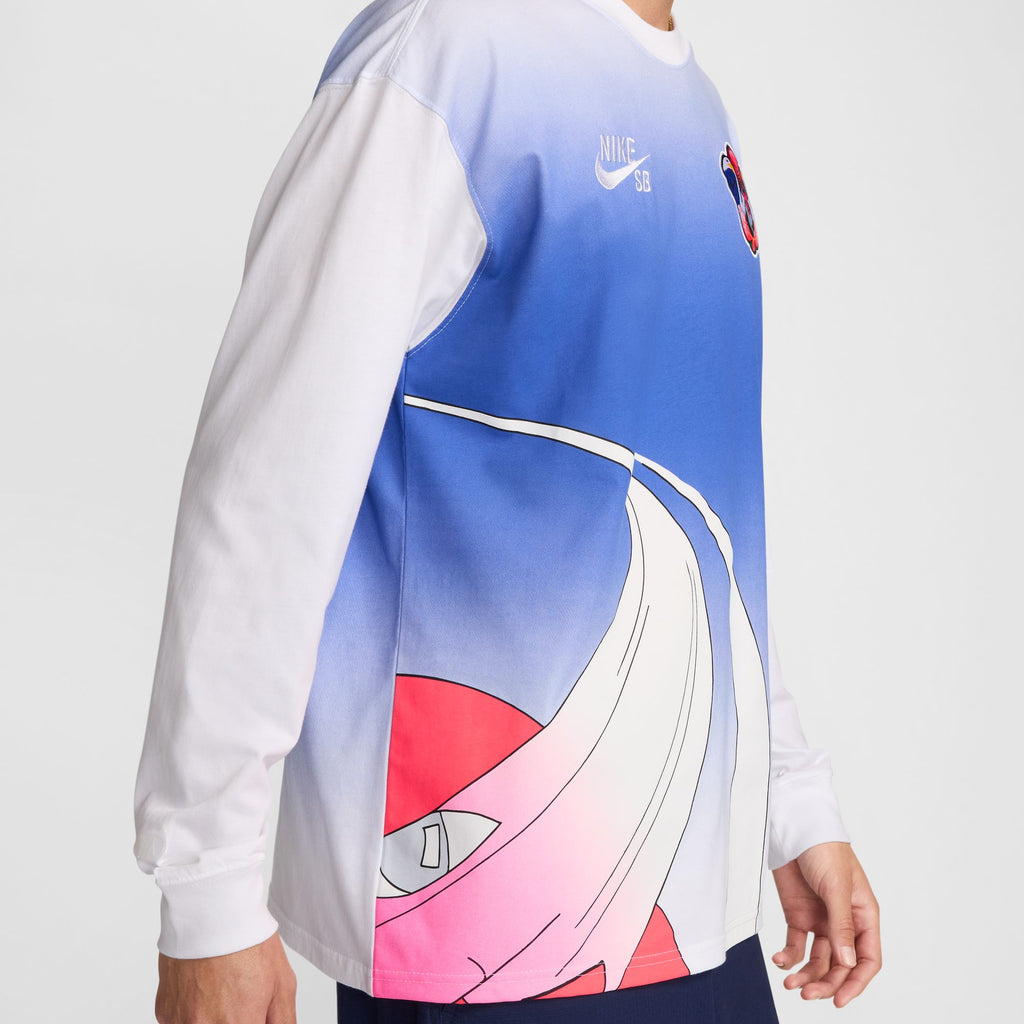 Person wearing a Nike SB 2024 Federation Kit Long Sleeve Skate Tee USA White, featuring a gradient blue and white design, a visible Nike logo, and a large, abstract red and white graphic. Made from midweight cotton, this shirt blends global inspiration with street style.