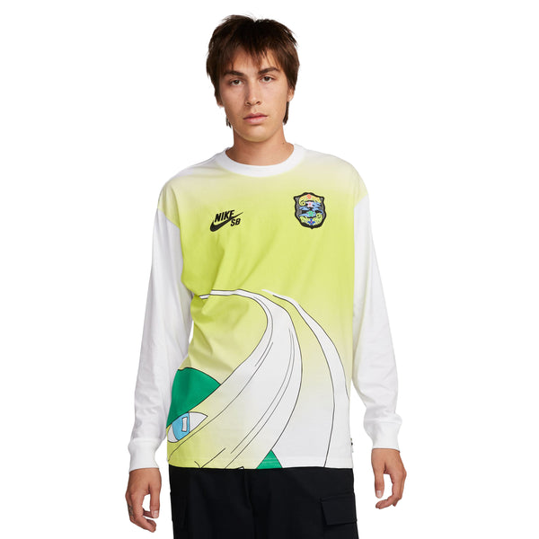 Person wearing a Nike SB 2024 Federation Kit Long Sleeve Skate Tee World White, featuring a yellow and white color scheme with graphic designs and logos on the chest, embodying the spirit of skateboarding.