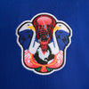 Embroidered patch featuring two stylized birds facing each other on a blue background, ideal for fans of Team USA and NIKE SB skateboarding enthusiasts. This design is part of the NIKE SB 2024 Federation Kit Skate Tee USA Old Royal by Nike.