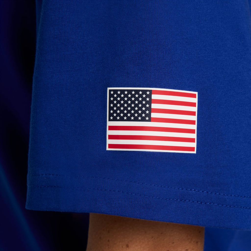 Close-up of a small American flag on the sleeve of the NIKE SB 2024 Federation Kit Skate Tee USA Old Royal, proudly representing Team USA.