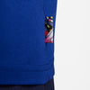 Close-up of the NIKE SB 2024 FEDERATION KIT SKATE TEE USA OLD ROYAL, featuring a small, colorful abstract patch sewn on the side, reminiscent of Team USA's spirit.