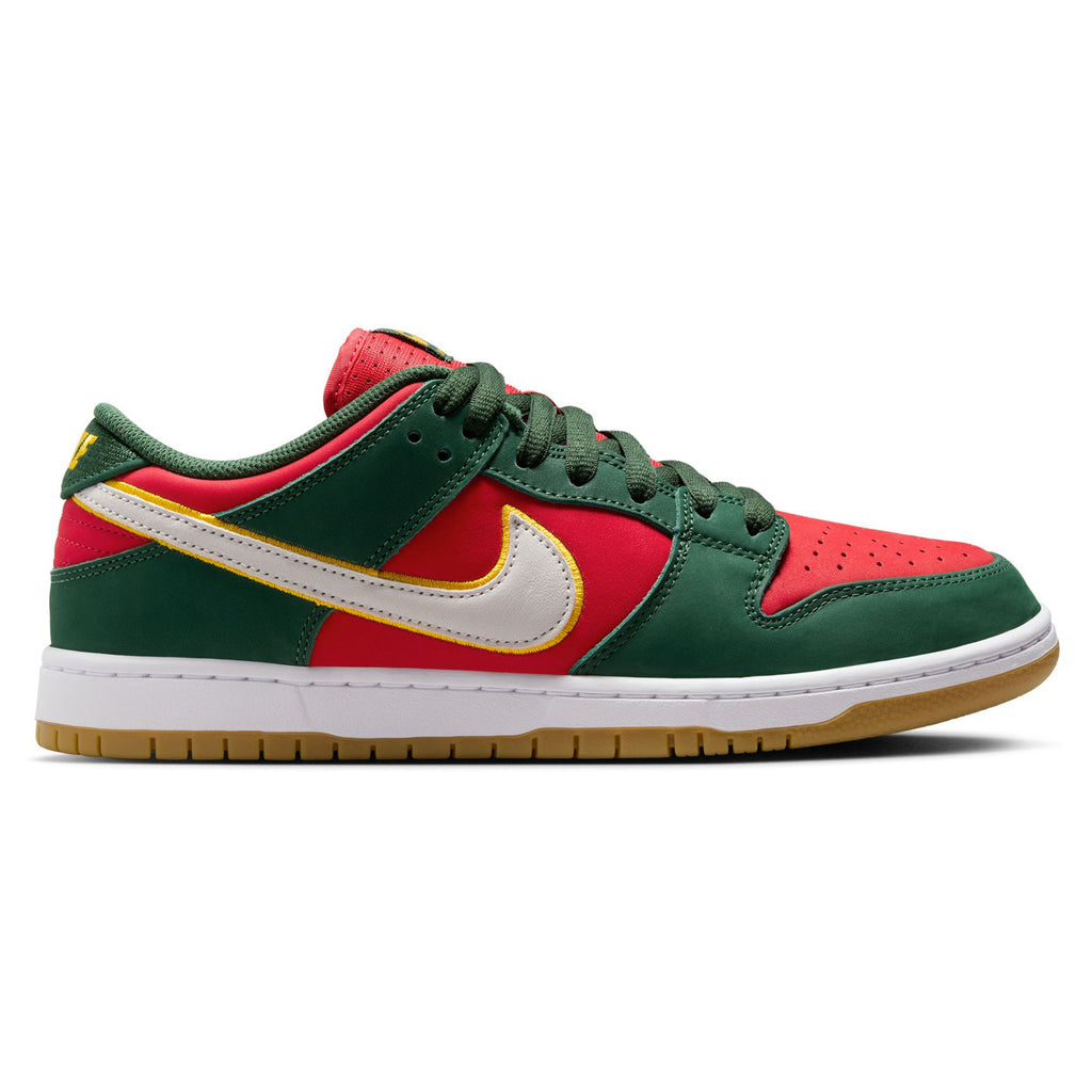 The NIKE SB 💫💚 by Nike showcases a vibrant combination of green, red, and gold colors, accented with a white midsole and gum outsole. Expertly crafted using premium materials for an extra touch of style.