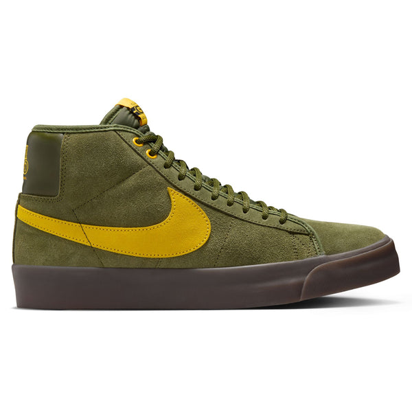 The Nike SB x Antihero Blazer GT Mid in Rough Green and Amarillo offers a suede texture with a vibrant yellow swoosh, brown sole, and is perfect for skateboard adventures.