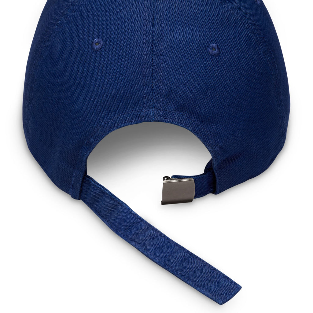 The image depicts the back of a Nike SB Club Hat in Blue Void/Game Royal, made from cotton twill, with an adjustable strap and metal buckle.