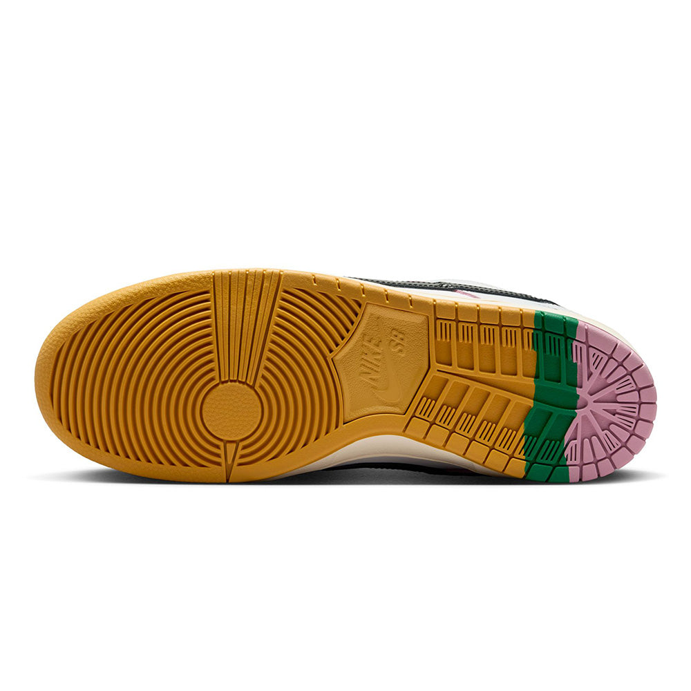 The image displays the sole of the Nike SB x CSEF Dunk Low Summit White/Black-White-Iron Grey sneaker, featuring yellow, green, and pink rubber sections and intricate tread patterns that highlight Nike's renowned quality.