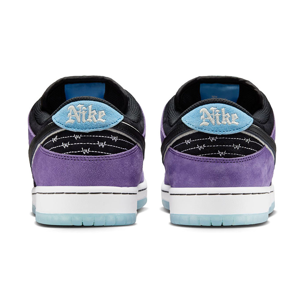 Rear view of the NIKE SB Hayley Wilson Dunk Low Pro in Court Purple/Black-White-Lagoon Pulse, crafted from premium materials with purple suede, black and white accents, blue heel tabs, and translucent soles.