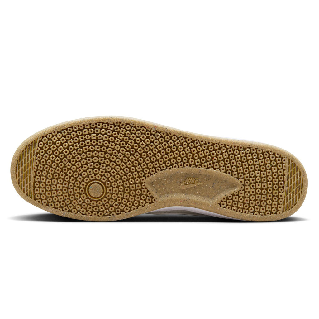 The outsole of the NIKE SB FC CLASSIC SUMMIT WHITE sneaker showcases a honeycomb pattern with the Nike SB logo, enveloped in an olive khaki textured rubber that is carefully engineered for traction, perfect for skateboarding.