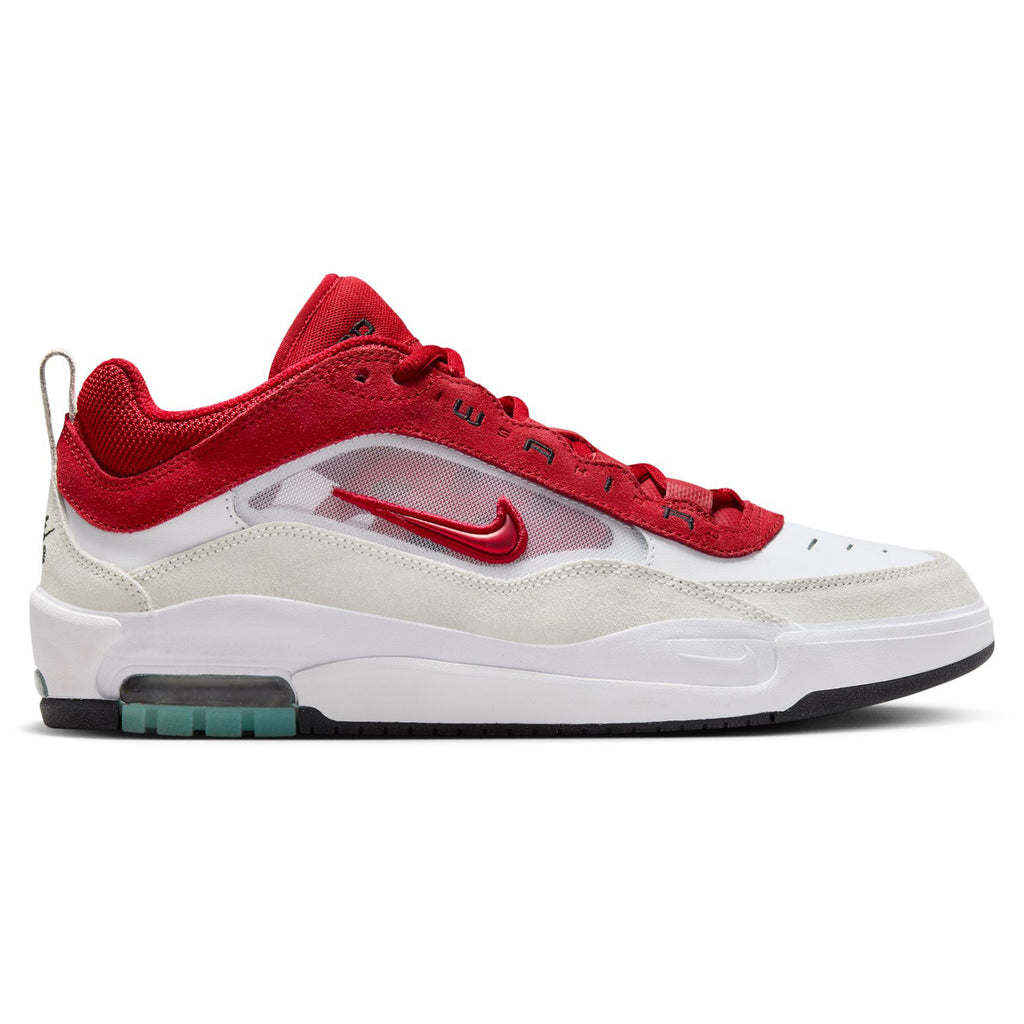 A shoe that features a sleek white and red colorway with mesh and a shiny red check on the side paneling.