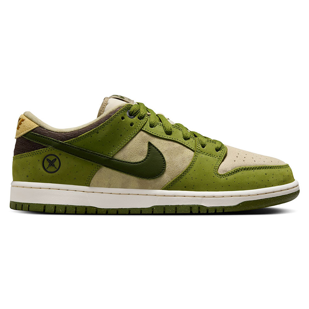 The RAFFLE WINNER NIKE SB YUTO "MATCHA" DUNK LOW PRO features asparagus and legion green with light khaki tones, a swoosh logo, perforated detailing, and a crossed-tools insignia on the heel. Crafted with premium materials for durable traction reminiscent of iconic Nike SB Dunks.