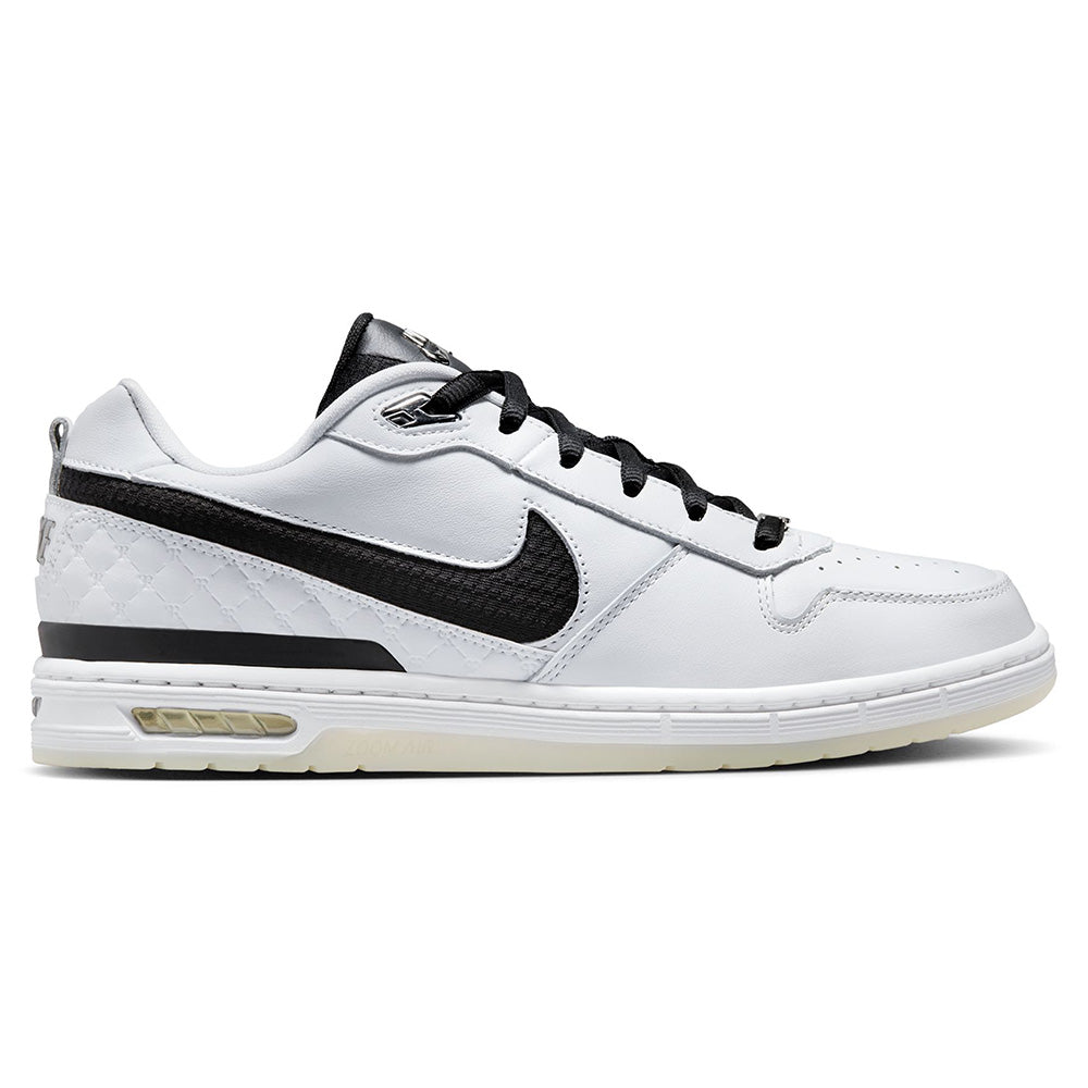 The NIKE SB P-ROD 1 ZOOM AIR LOW 20 YEARS in white/black features a classic low-top design with black accents and laces, a black Nike swoosh, and cushioned sole—ideal for everyday wear or skateboarding education fans.