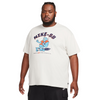 The man is wearing a nike SB 'Sports Guy' skate tee light bone.