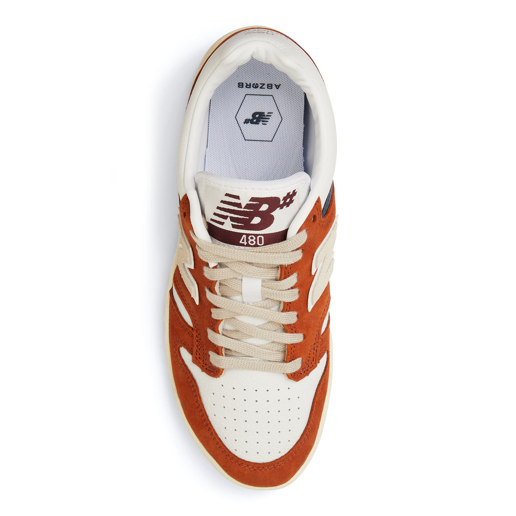 A new NB NUMERIC 480 BROWN / WHITE sneaker in orange and white.