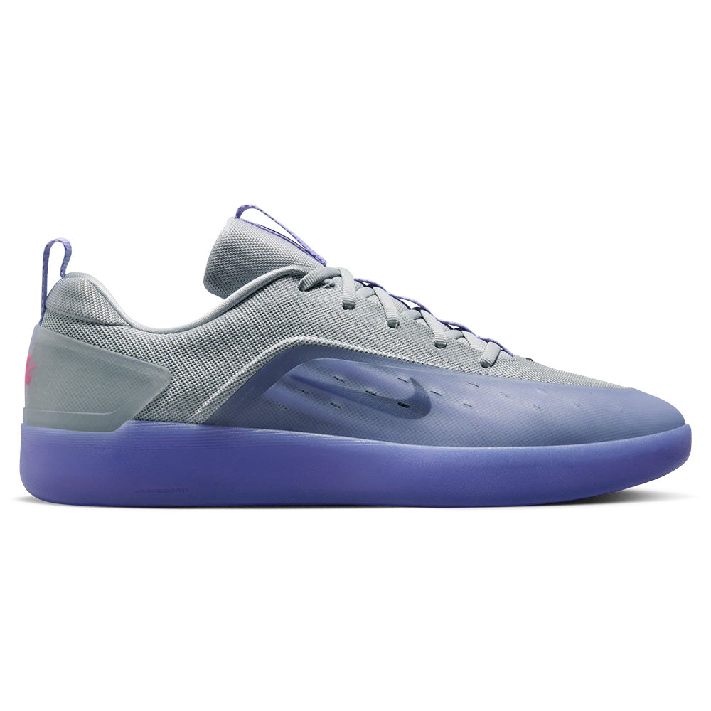 The nike SB NYJAH 4 in Lt Thistle/Black-Lt Thistle-Wolf Grey-Hyper Pink features a mesh upper, translucent side panel, and solid purple sole, displayed in a side profile view.