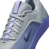 Close-up of the NIKE SB NYJAH 4 LT THISTLE by nike, featuring a textured wolf grey upper, light thistle purple laces, and a purple-hued sole for lightweight durability and style.