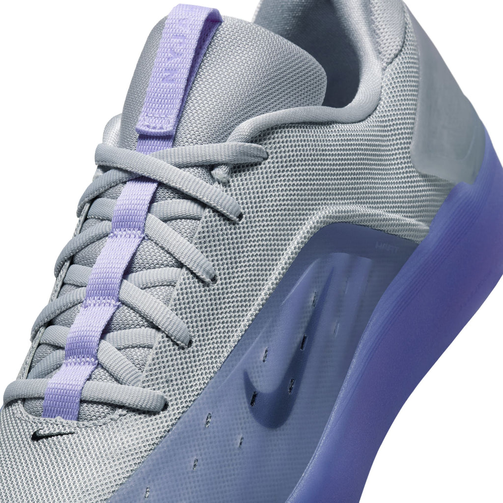 Close-up of the NIKE SB NYJAH 4 LT THISTLE by nike, featuring a textured wolf grey upper, light thistle purple laces, and a purple-hued sole for lightweight durability and style.