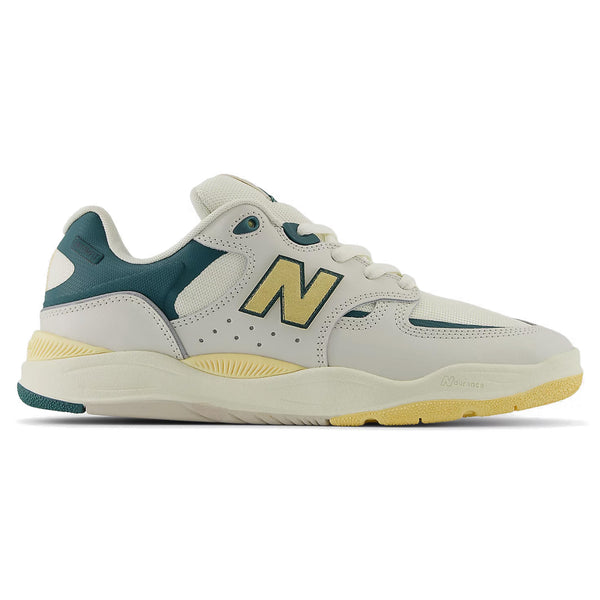 A new NB Numeric 1010 Tiago White / New Spruce balance sneaker with gray, teal, and yellow accents designed by Tiago Lemos features the innovative FuelCell foam.