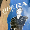 Close-up image of a graffiti-style stencil artwork of a figure with bold facial features on a North American Maple background, with the word "OPERA KREINER CUTTER" printed above.