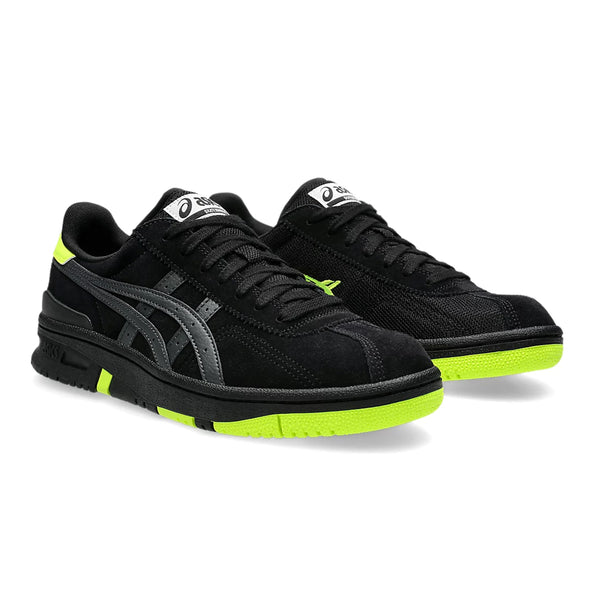 A pair of black ASICS VIC NBD sneakers with neon yellow accents, displayed against a white background.