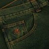 Close-up image of a green denim fabric showing a front pocket with orange stitching and an embroidered logo. The semi-baggy fit offers comfort, and the material is 100% cotton-denim fabric. This is the POLAR '93! DENIM CHARTREUSE / BLUE by POLAR.