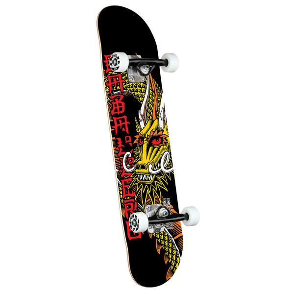 A POWELL PERALTA CAB BAN THIS COMPLETE skateboard with a dragon on it.