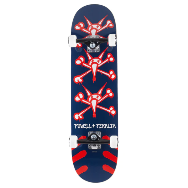 A navy complete skateboard with black trucks and white wheels with red/white rat heads and crossbones.