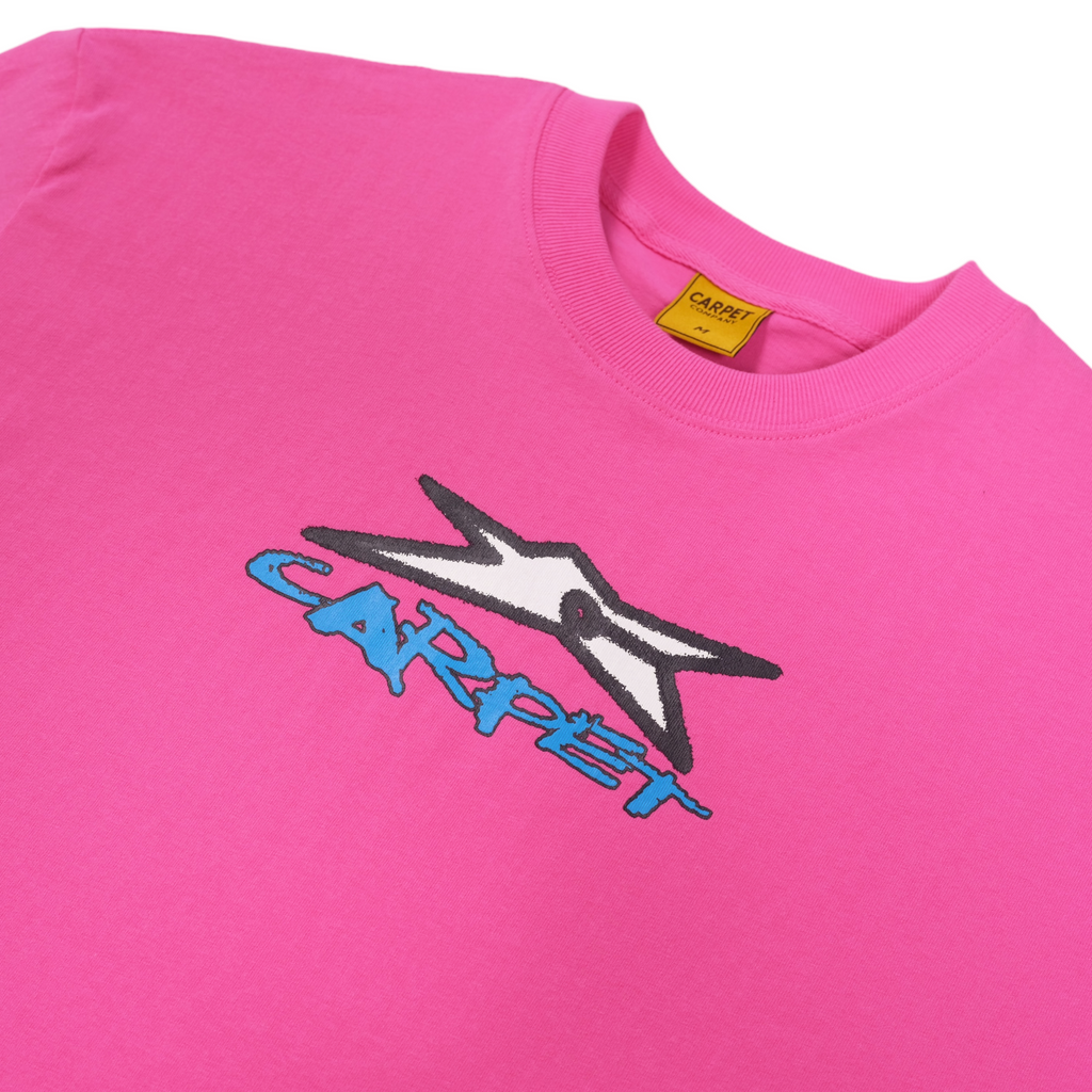 A close up of a bright pink shirt with the carpet start logo on it in white.