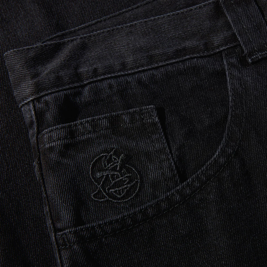 A pair of POLAR '93! DENIM PITCH BLACK pants with a logo on the pocket.