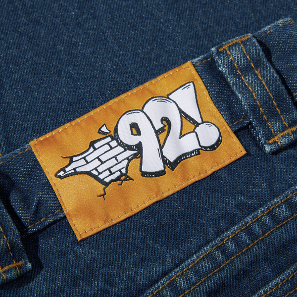 The back pocket of a pair of POLAR '92! DENIM DARK BLUE jeans with a logo on it.