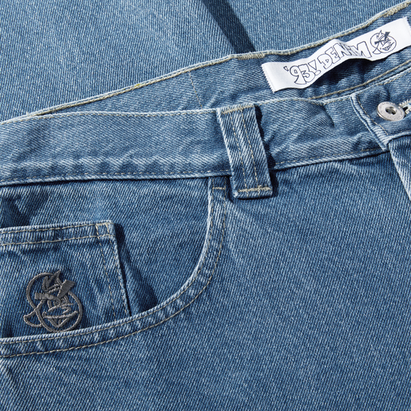 A pair of POLAR '93! DENIM MID BLUE jeans with a logo on the pocket.