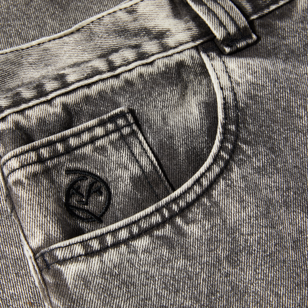 The pocket of a pair of POLAR jeans with a logo on it.