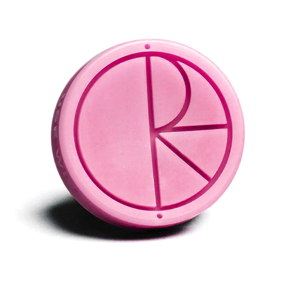 A POLAR 'USE WISELY' WAX PINK button with the letter r on it.