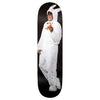 A person in a white rabbit costume holds a carrot and smiles, standing against a black background on the REAL ISHOD BUNNY TWIN TAIL skateboard by REAL.