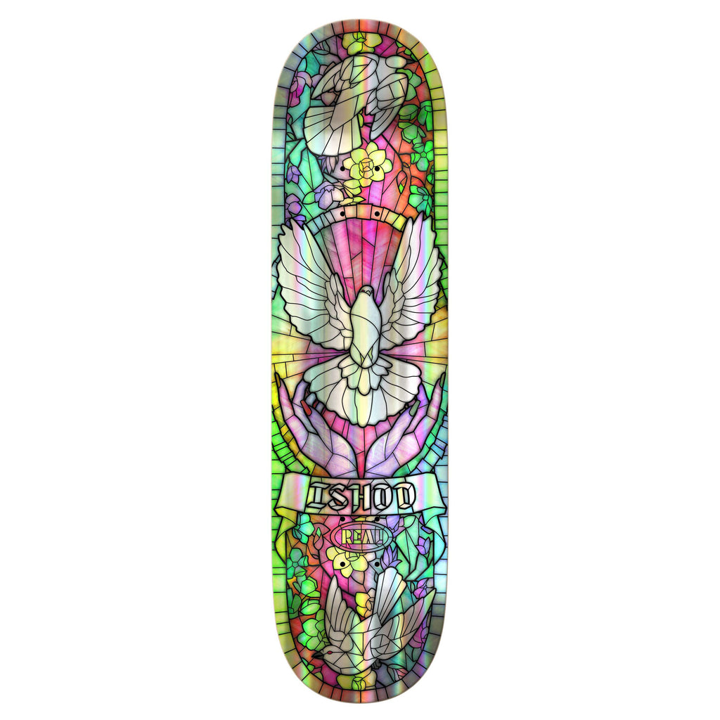 The REAL ISHOD CATHEDRAL TT HOLO RAINBOW FOIL skateboard deck from REAL features a stunning stained glass-style design with white doves, purple floral elements, and the word "SHOOT" at the center, capturing attention with its vibrant aesthetics.